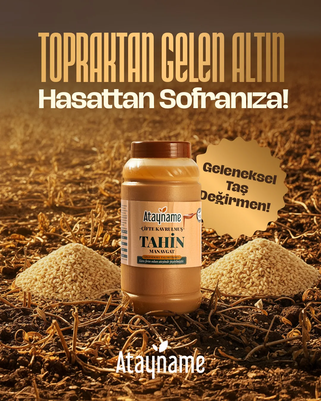 Hasat edilmiş tarlada iki susam yığınının arasında büyük Atayname tahin kavanozu; "TOPRAKTAN GELEN ALTIN — Hasattan Sofranıza!" başlığı ve "Geleneksel Taş Değirmen" rozeti.