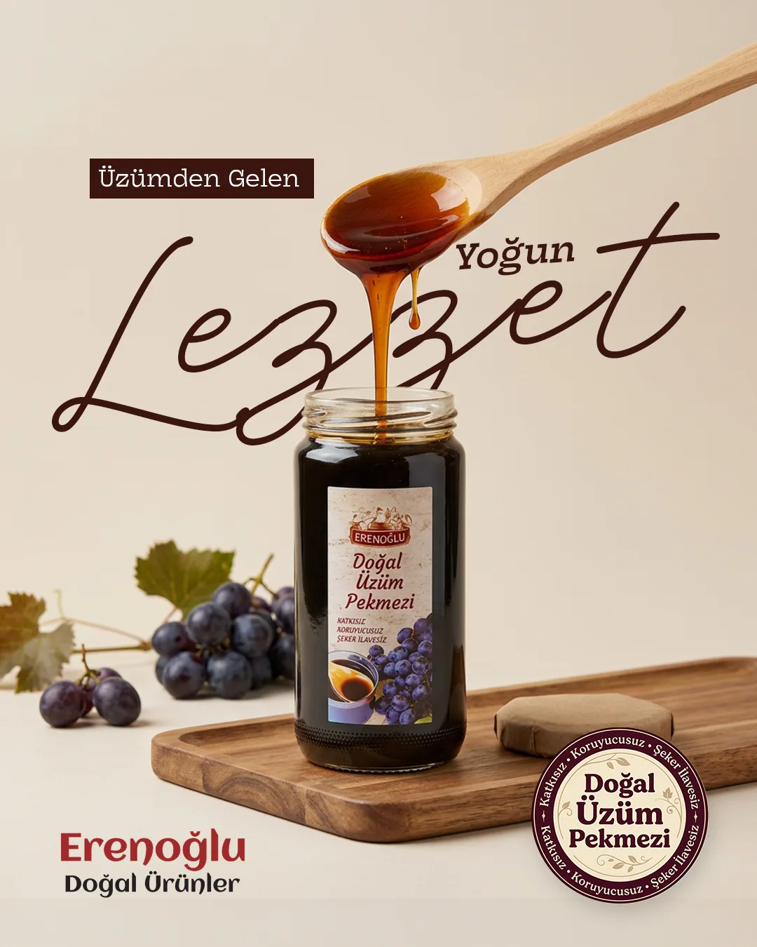 Dark grape molasses dripping from a spoon into a jar beside a bunch of grapes; a script "Lezzet" headline and a seal.